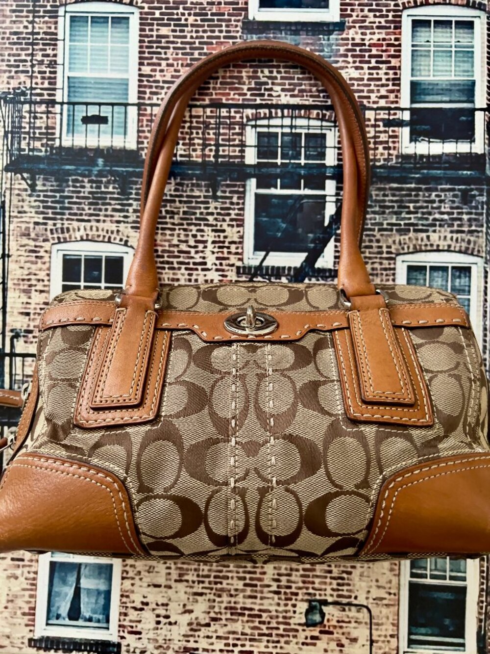 Coach signature monogram canvas satchel handbag with tan leather trim and dual